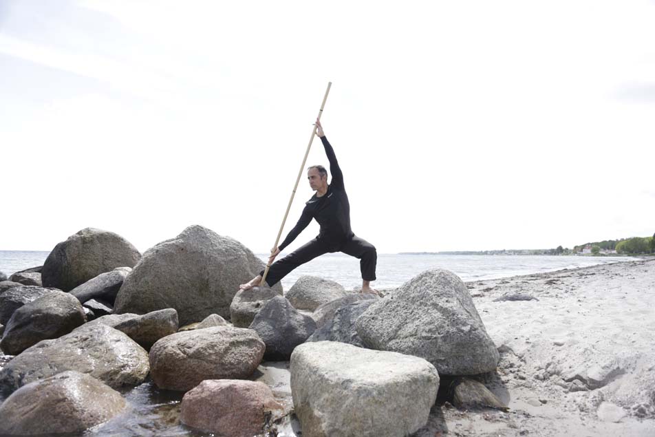 Marcus with stick on beach